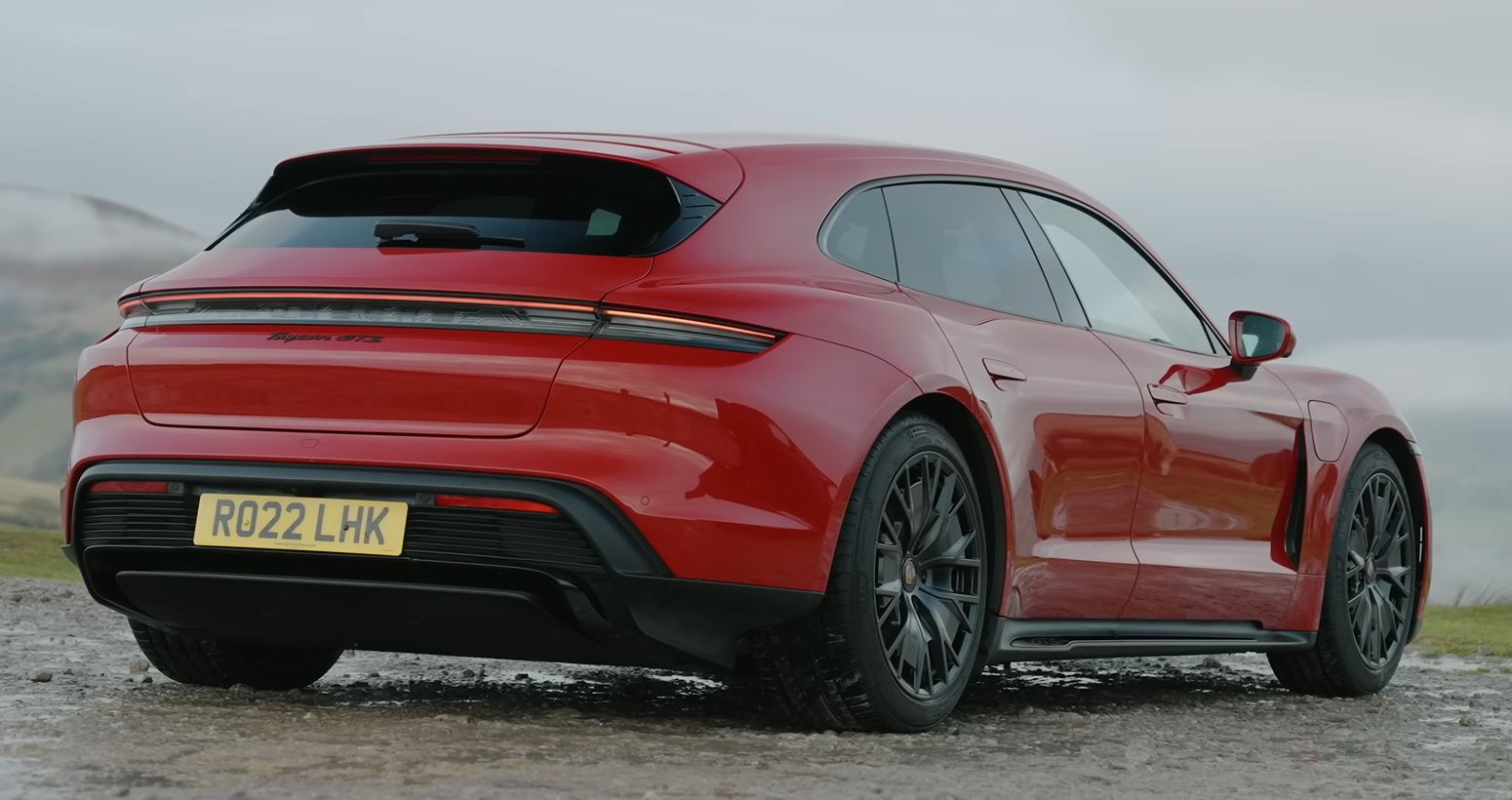 Red Porsche Taycan GTS rear-side shot