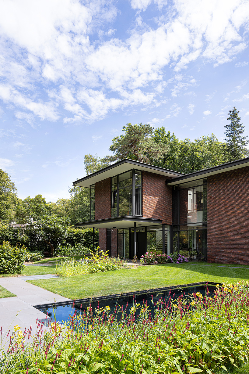 red brick facade and steel fascias form villa trompenberg in the netherlands