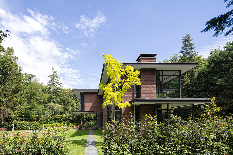 red brick facade and steel fascias form villa trompenberg in the netherlands