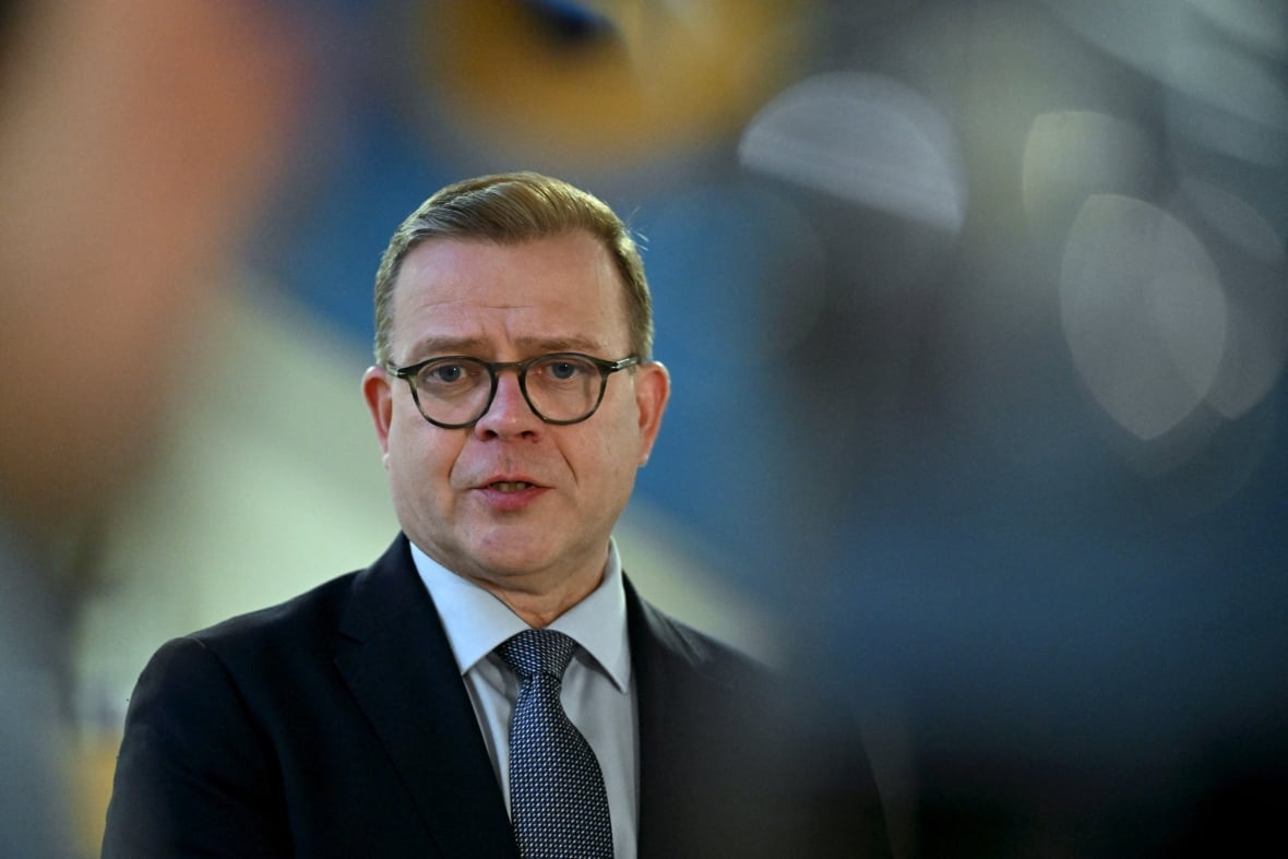 A person is pictured speaking during a news conference.